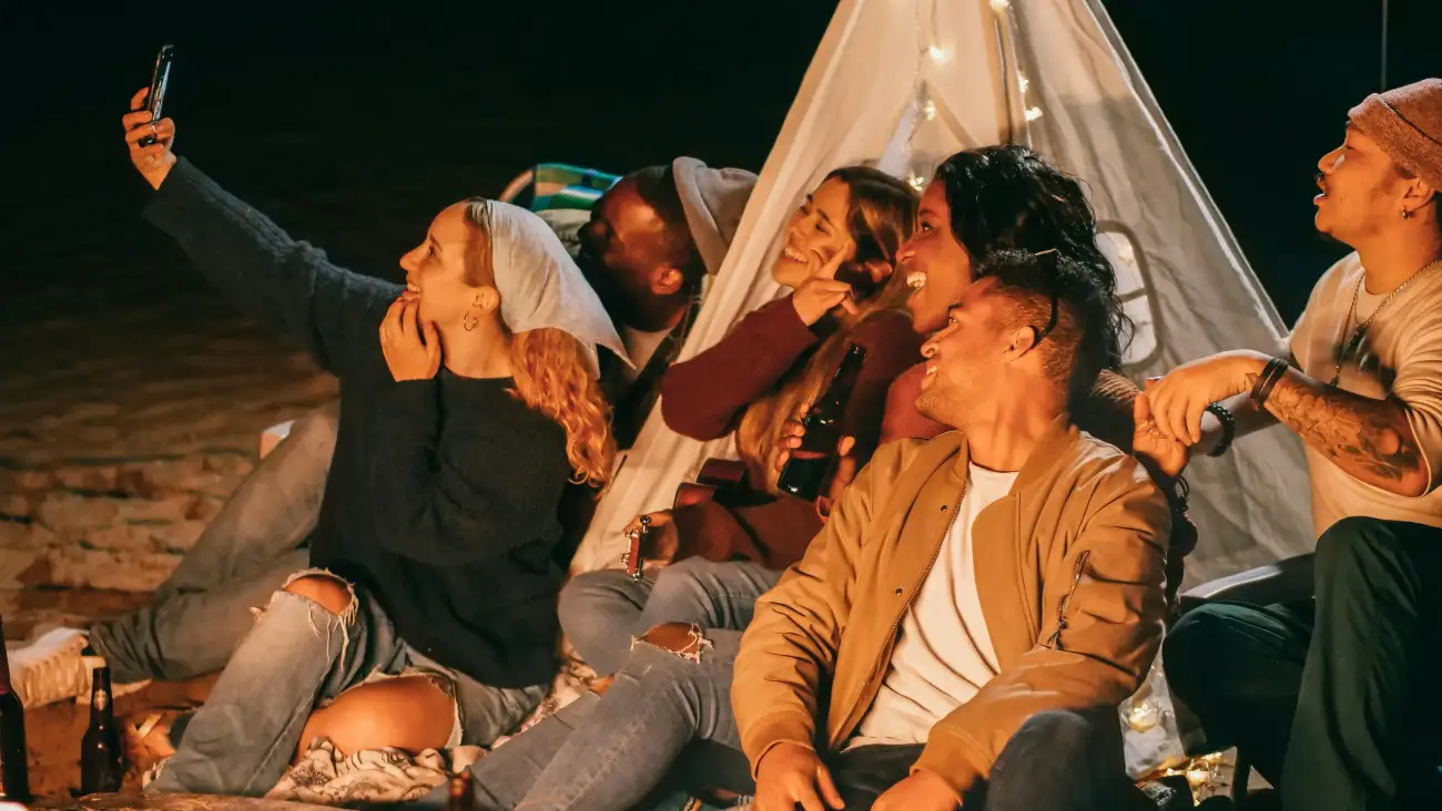 Group photo of a team enjoying camping